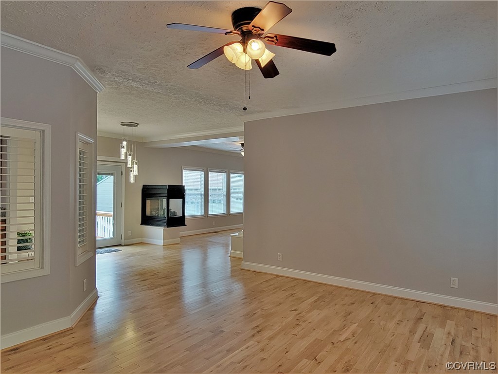 13569 Greenwood Road Glen Allen, VA 23059 - Photo 5 of 49 a view of empty room with wooden floor and fan
