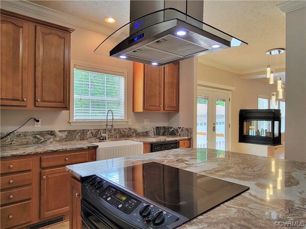 13569 Greenwood Road Glen Allen, VA 23059 - Photo 8 of 49 a kitchen with stainless steel appliances granite countertop a sink a stove and cabinets