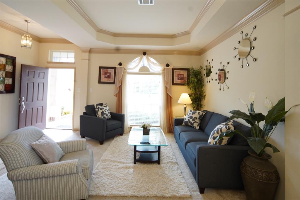 4508 Fox Rio Trail Arlington, TX 76017 - Photo 28 of 28 a living room with furniture and a chandelier