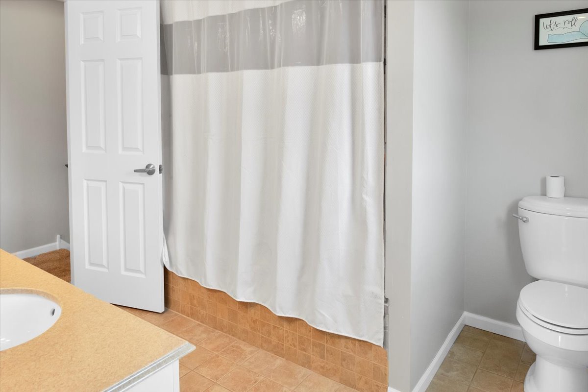 24457 South Tree Ridge Court Channahon, IL 60410 - Photo 20 of 32 a bathroom with a sink and a toilet