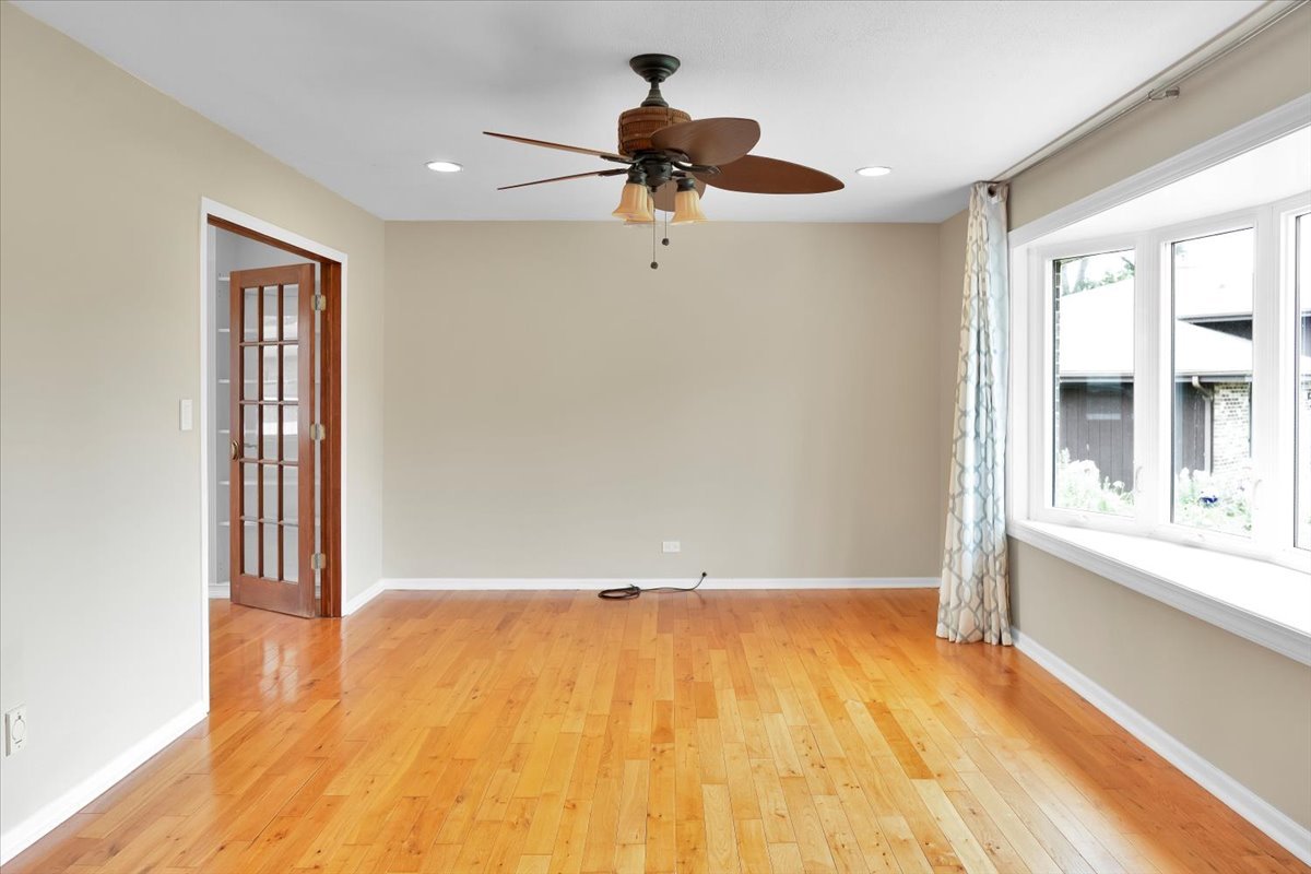 24457 South Tree Ridge Court Channahon, IL 60410 - Photo 5 of 32 a view of empty room with wooden floor and fan