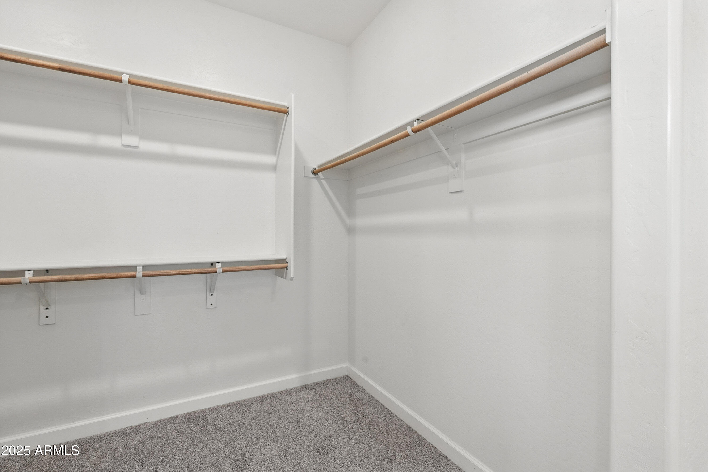2816 West Pollack Street Phoenix, AZ 85041 - Photo 27 of 63 a view of an empty walk in closet