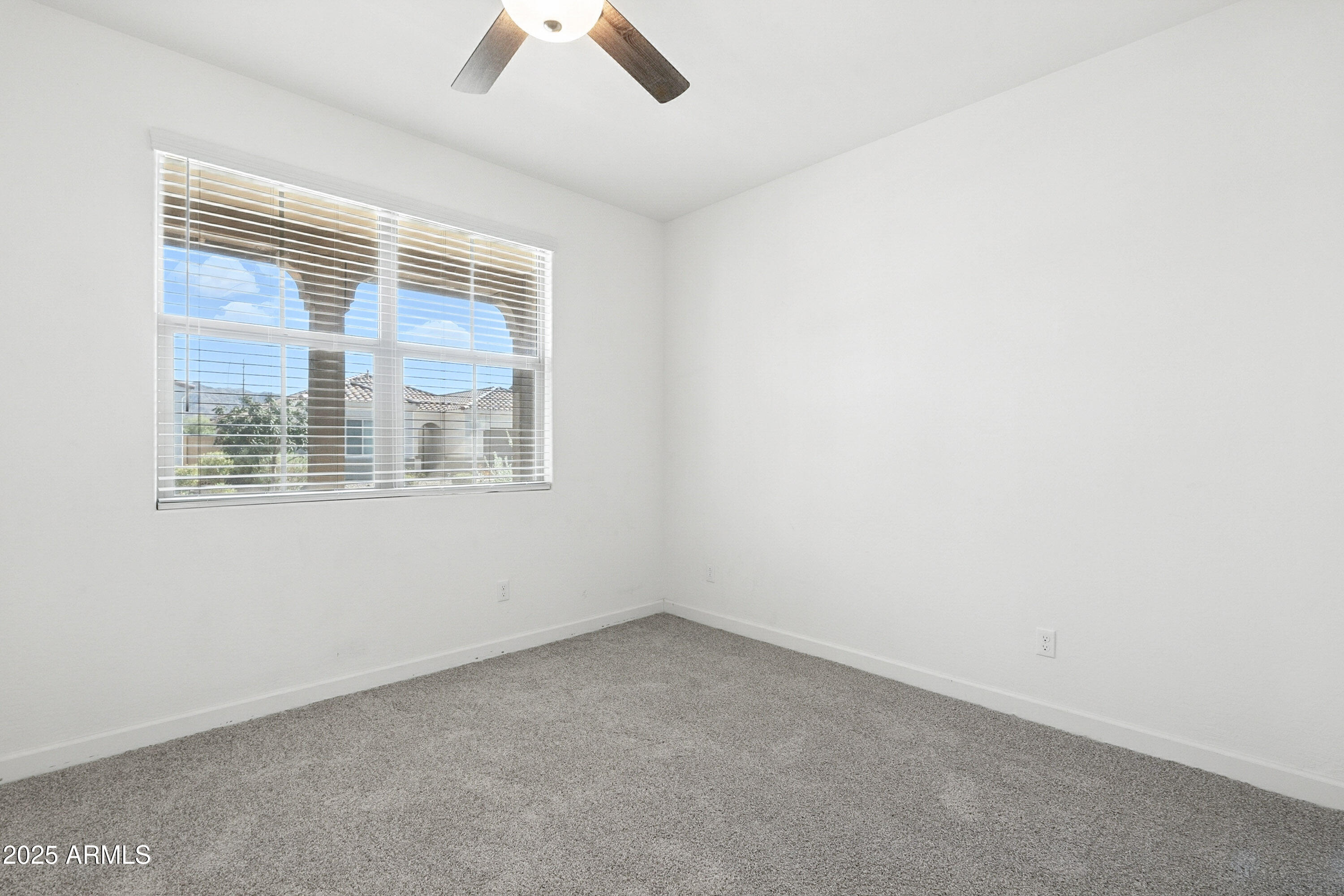 2816 West Pollack Street Phoenix, AZ 85041 - Photo 30 of 63 an empty room with a window