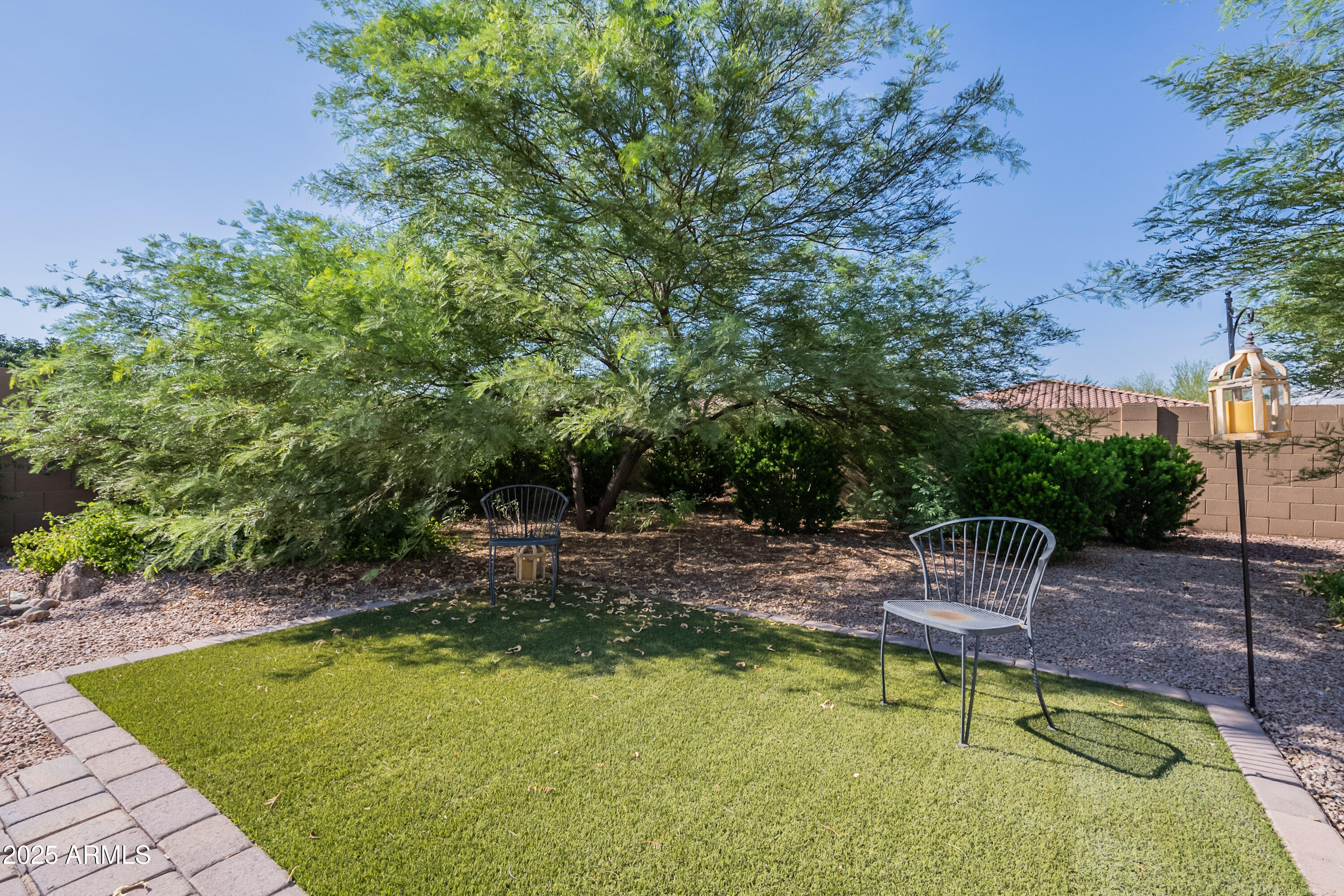 2816 West Pollack Street Phoenix, AZ 85041 - Photo 42 of 63 a view of a swimming pool with chairs