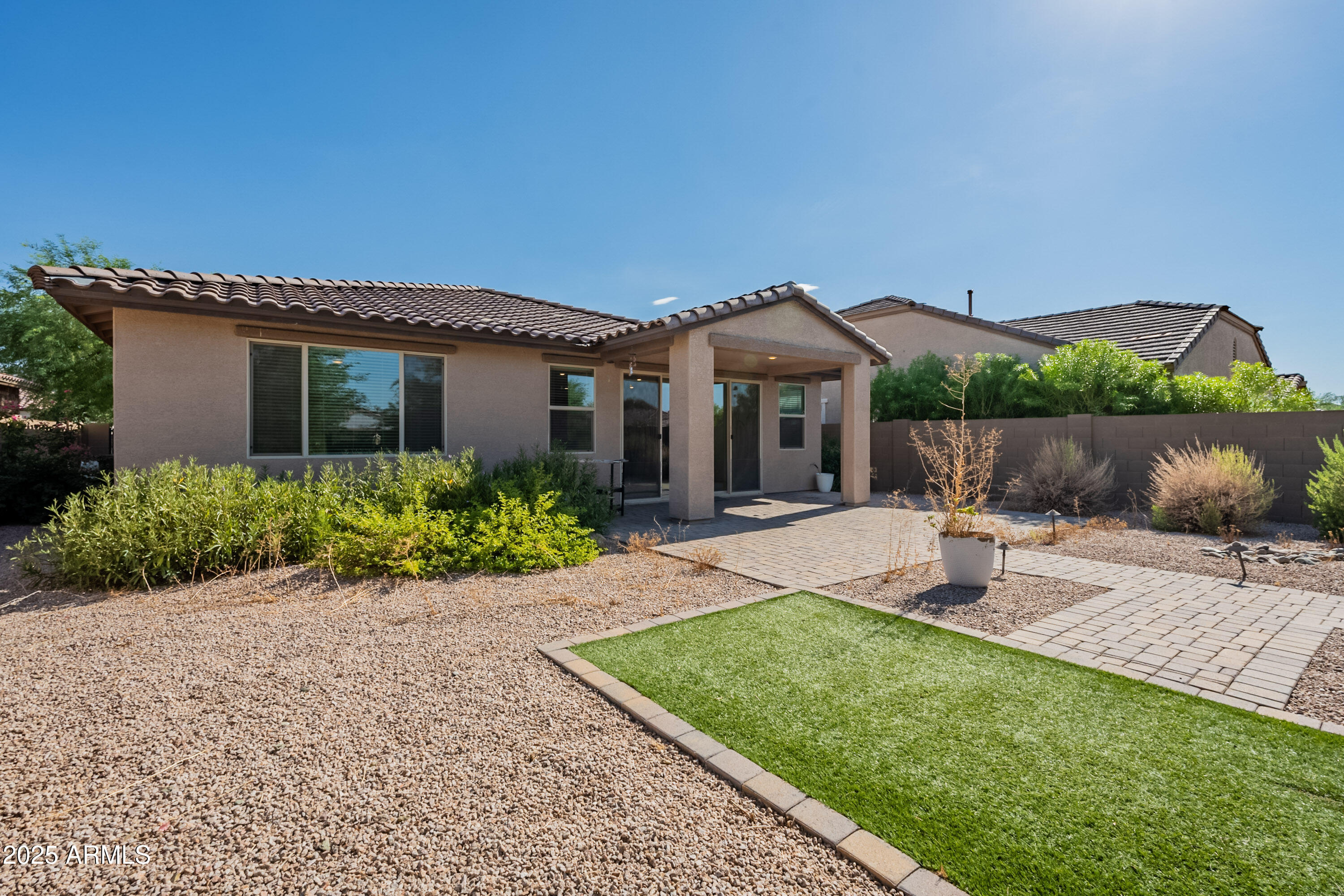 2816 West Pollack Street Phoenix, AZ 85041 - Photo 44 of 63 a front view of a house with garden