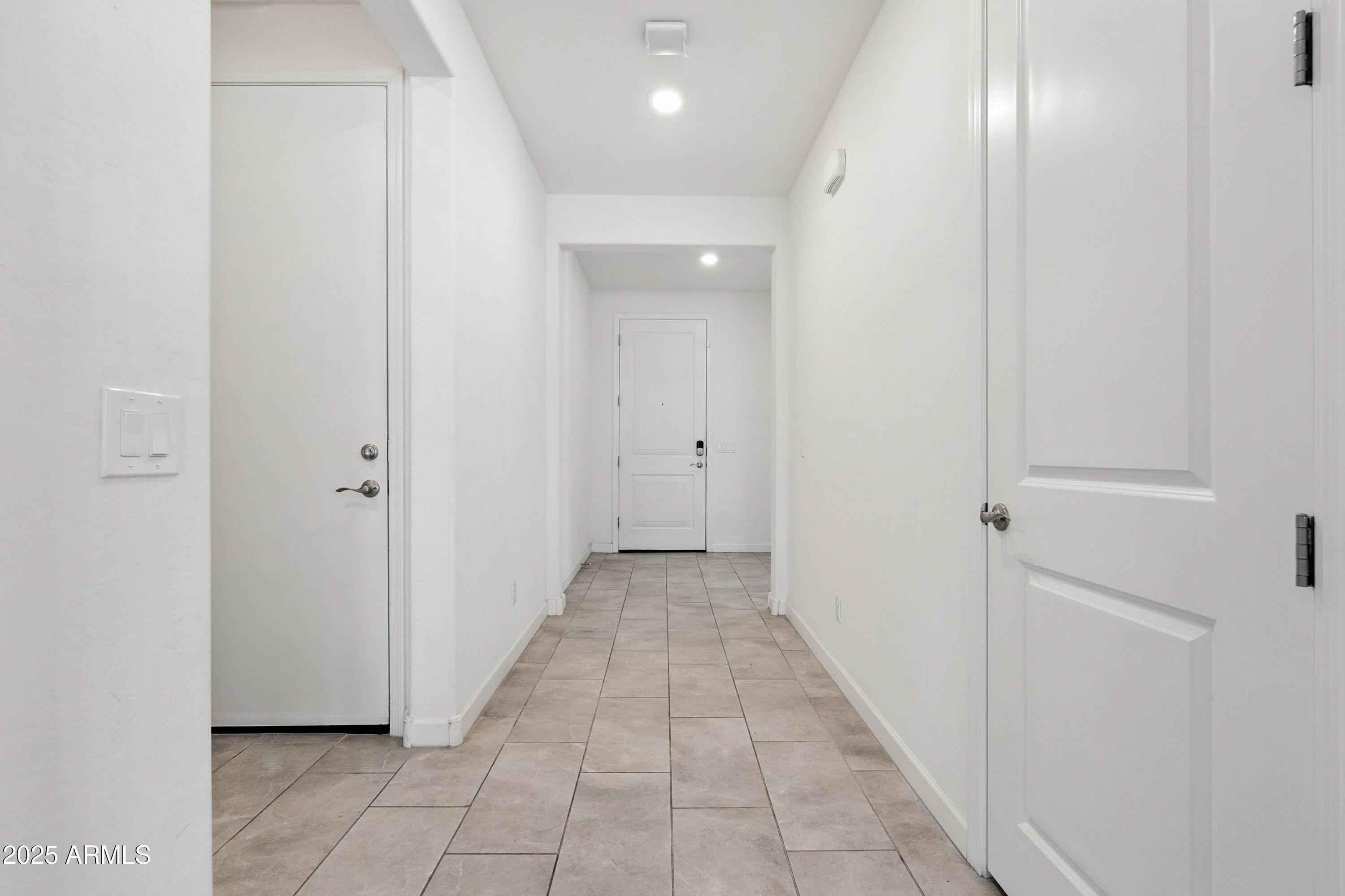 2816 West Pollack Street Phoenix, AZ 85041 - Photo 49 of 63 a view of a hallway with wooden floor