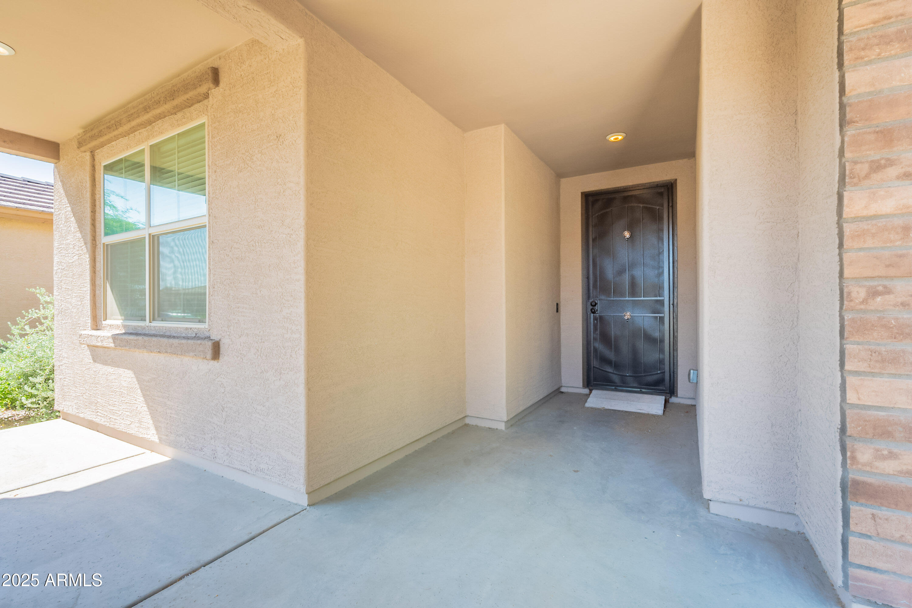 2816 West Pollack Street Phoenix, AZ 85041 - Photo 58 of 63 an empty room with windows and entrance
