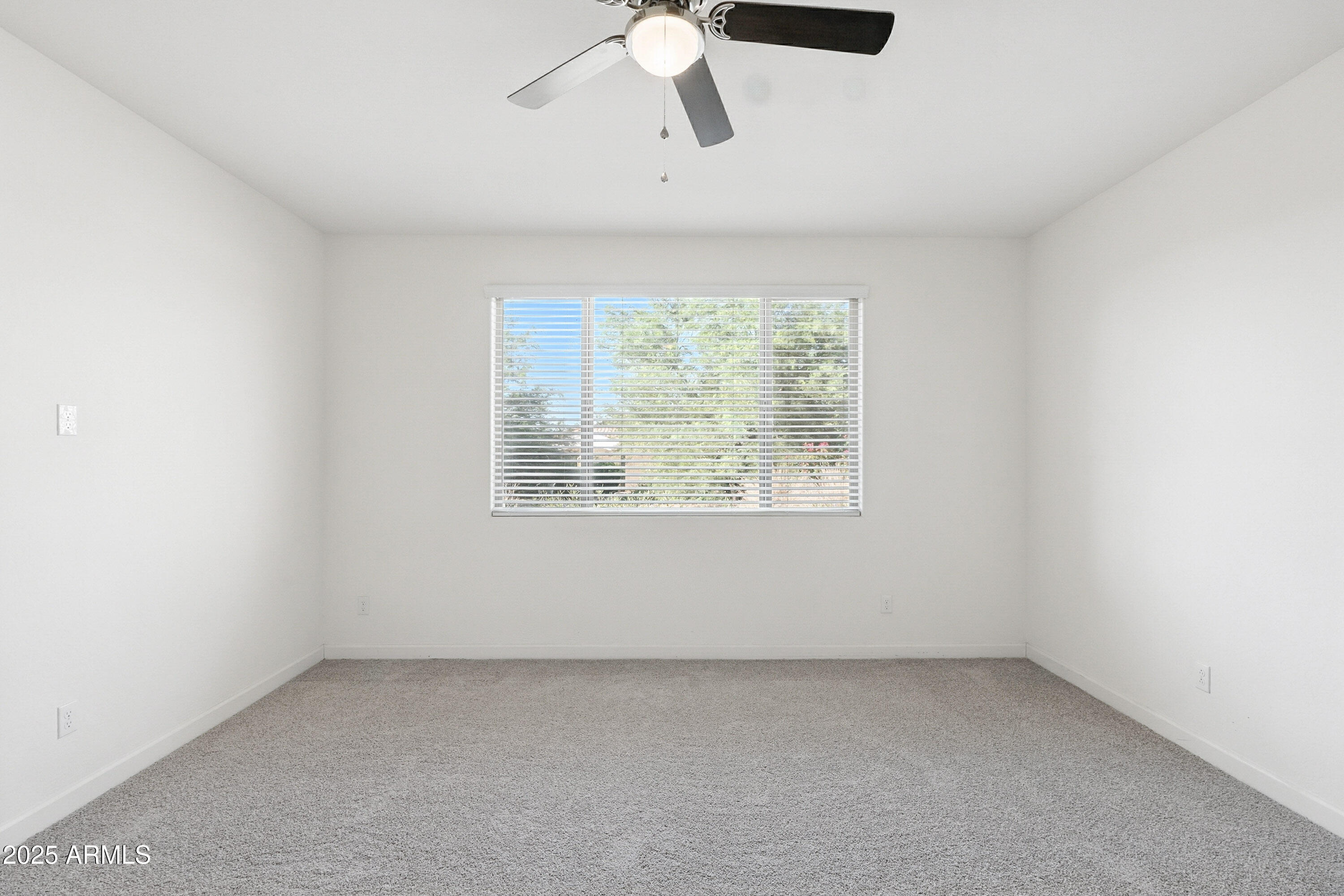 2816 West Pollack Street Phoenix, AZ 85041 - Photo 59 of 63 an empty room with a window