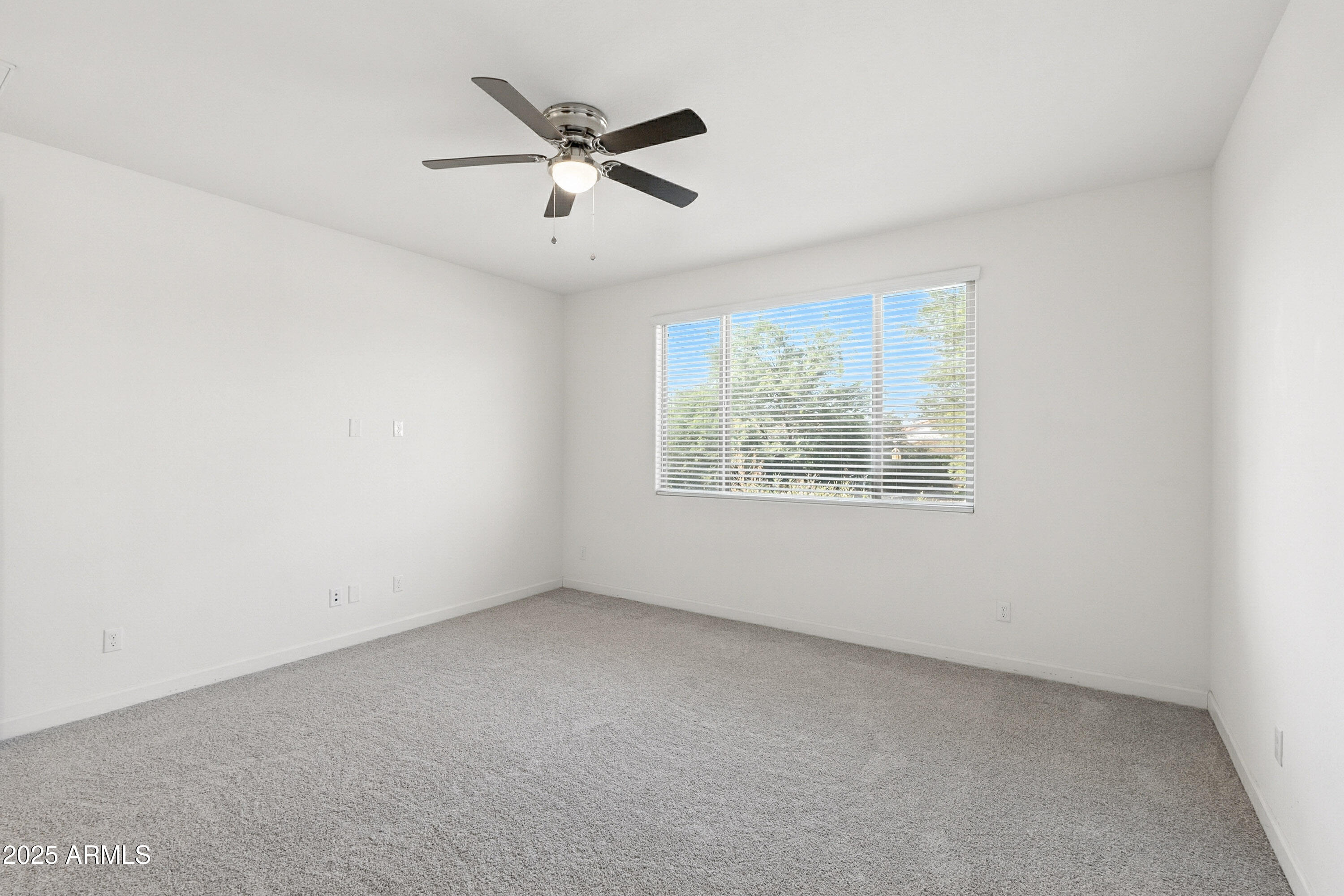 2816 West Pollack Street Phoenix, AZ 85041 - Photo 60 of 63 an empty room with a window