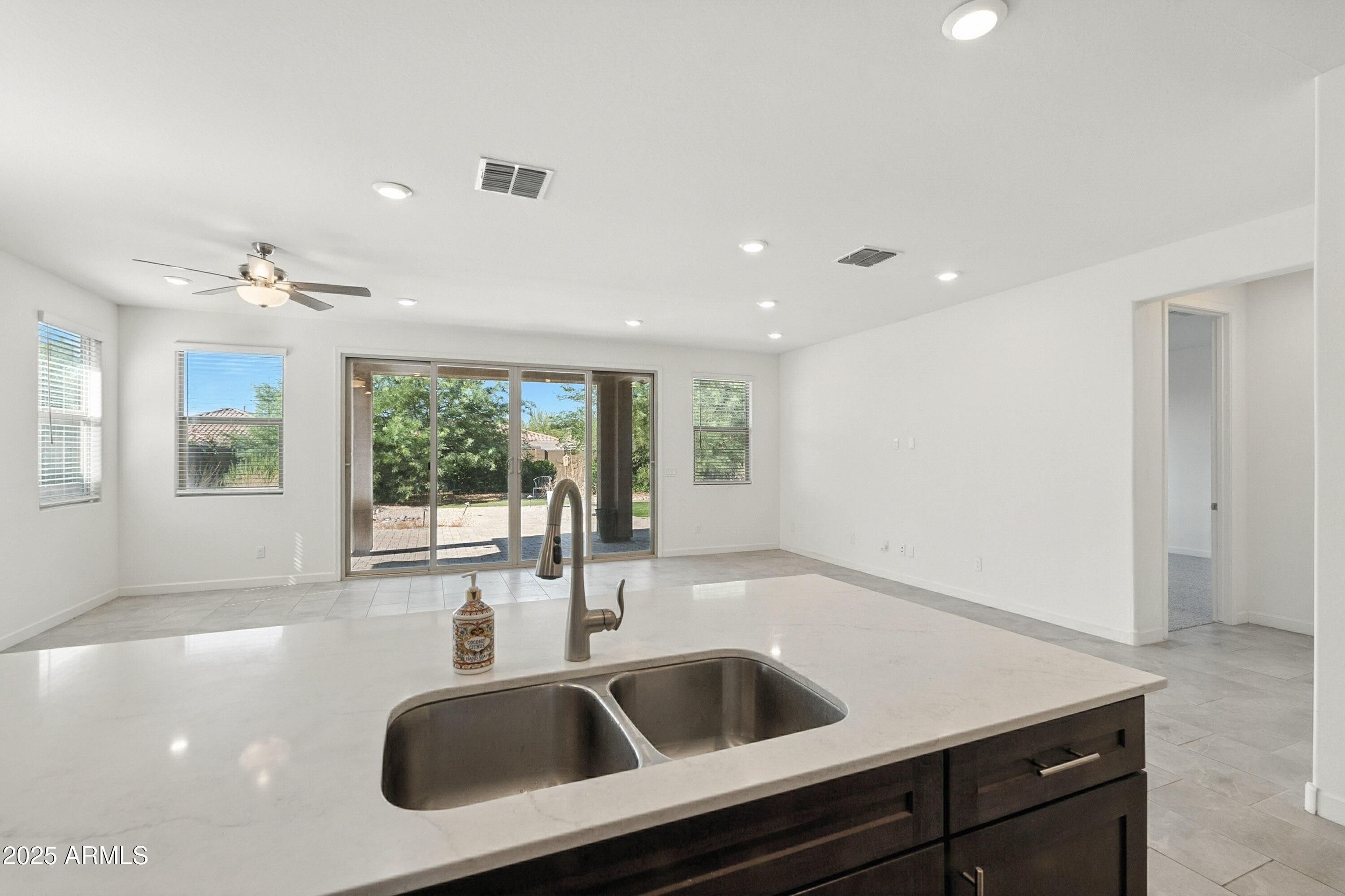 2816 West Pollack Street Phoenix, AZ 85041 - Photo 8 of 63 a kitchen with a sink and large window