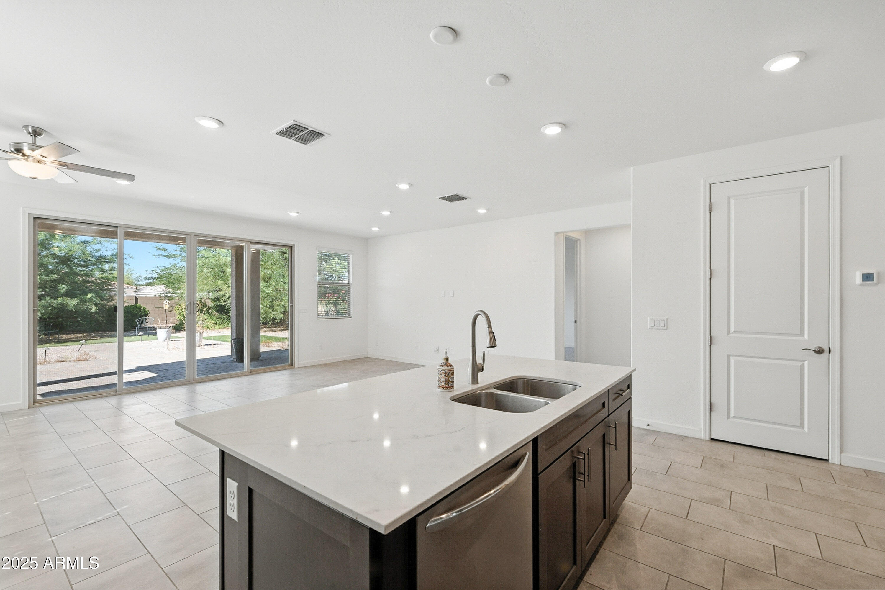 2816 West Pollack Street Phoenix, AZ 85041 - Photo 9 of 63 a kitchen with a sink and large window