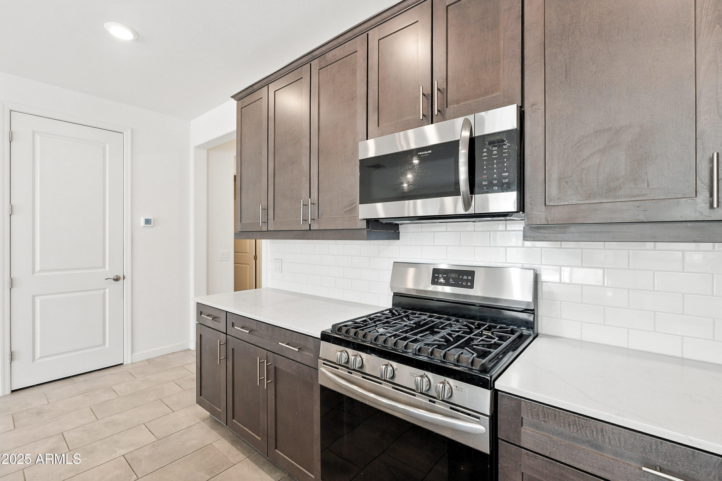 2816 West Pollack Street Phoenix, AZ 85041 - Photo 10 of 63 a kitchen with cabinets and steel appliances