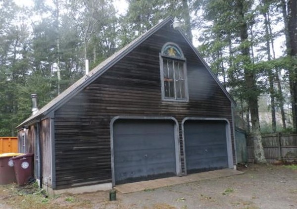 84 Mendall Road Acushnet, MA 02743 - Photo 4 of 11 a front view of a house with garage
