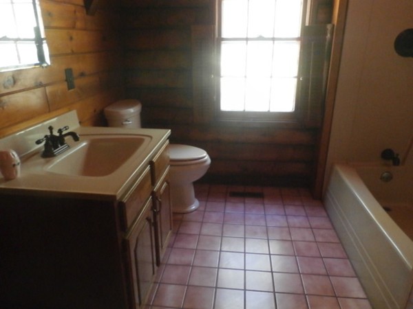 84 Mendall Road Acushnet, MA 02743 - Photo 8 of 11 a bathroom with a sink a toilet and bathtub