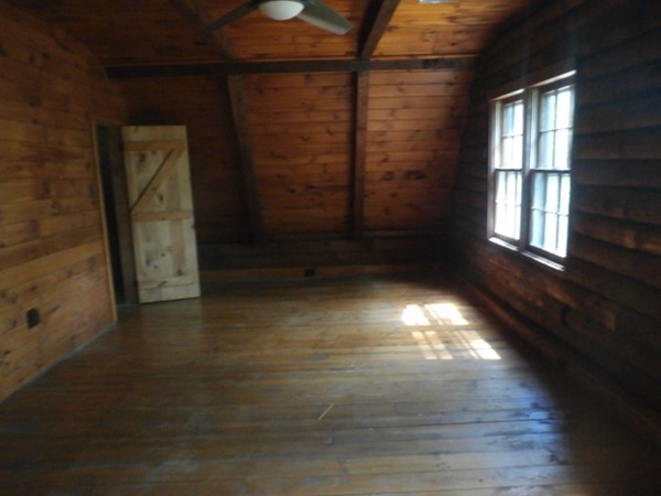 84 Mendall Road Acushnet, MA 02743 - Photo 9 of 11 a view of an empty room with wooden floor and a window