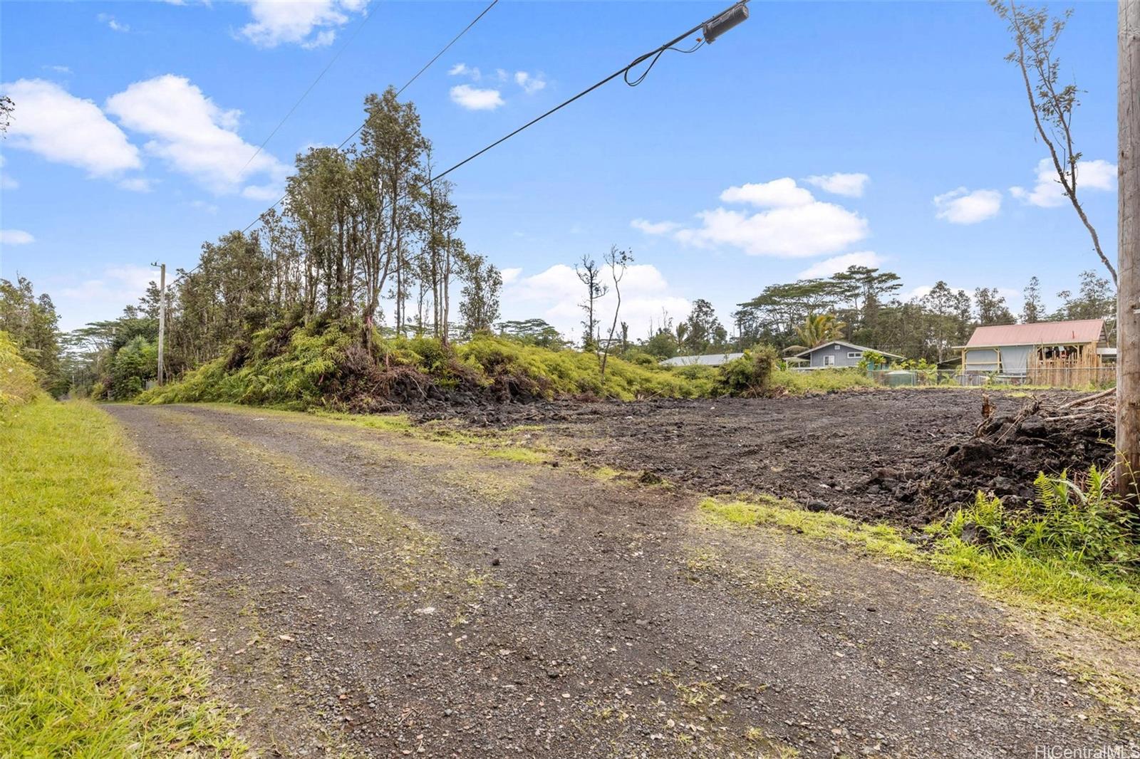 14-3440 Oahu Road, Unit LOT 917 Pahoa, HI 96778 - Photo 5 of 25 a view of a yard with a trees