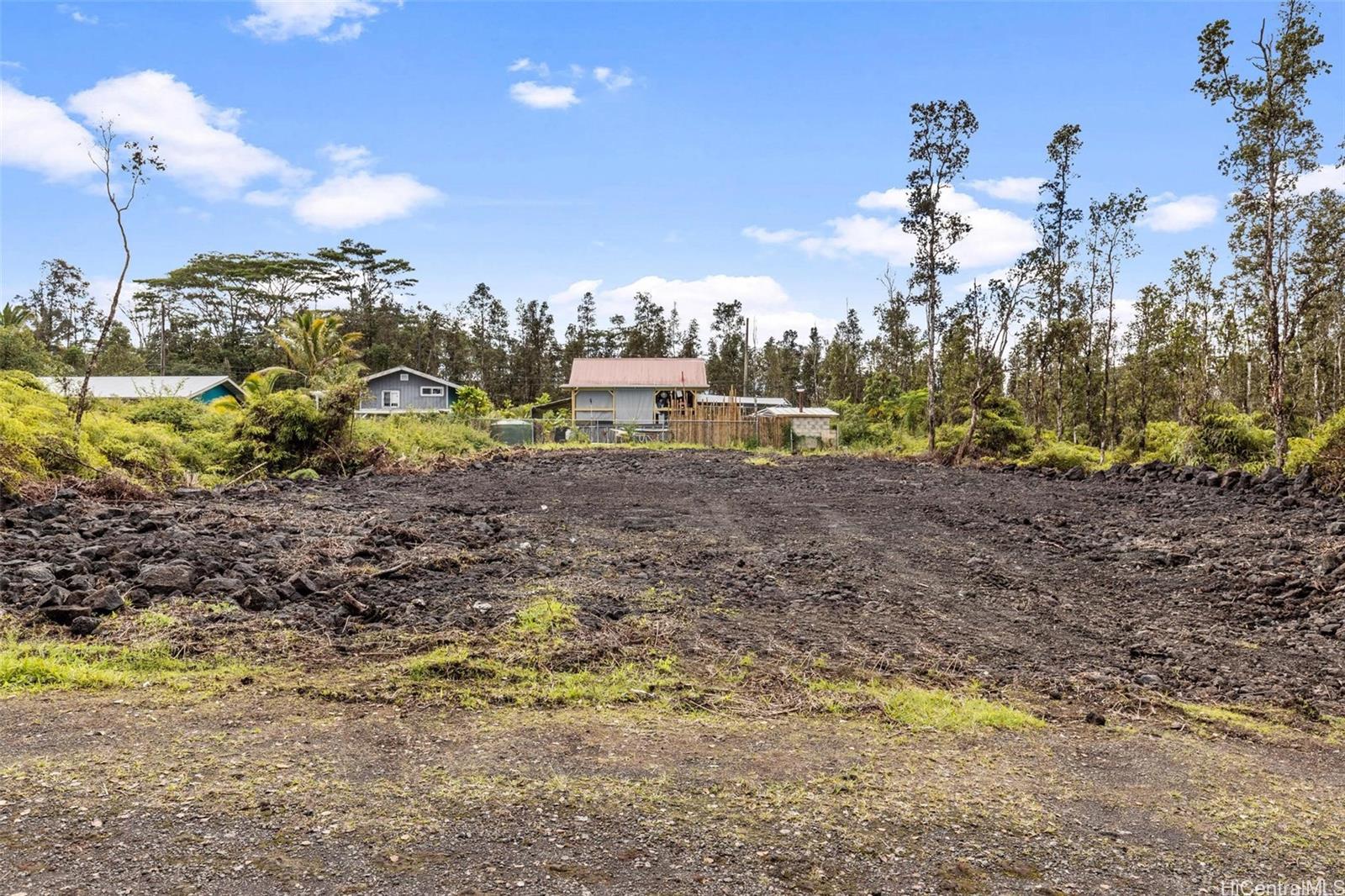 14-3440 Oahu Road, Unit LOT 917 Pahoa, HI 96778 - Photo 9 of 25 a view of a yard with a tree