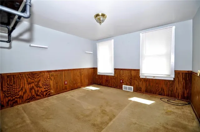a view of a livingroom with furniture and a window