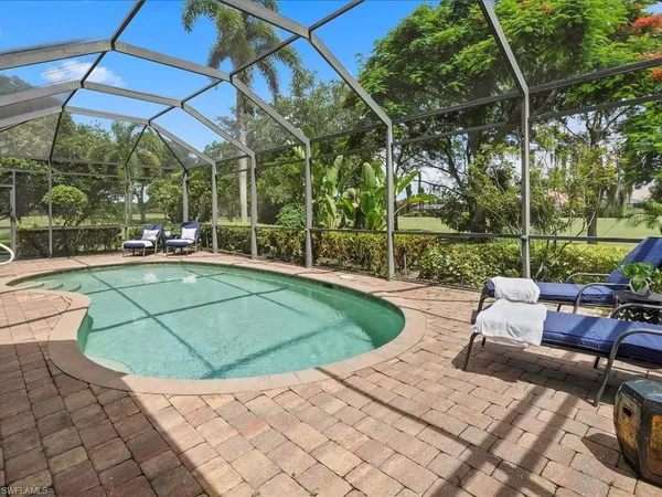 a view of a backyard with sitting area