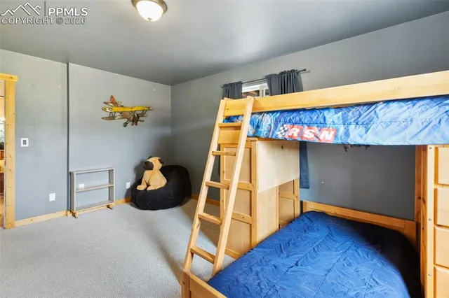 a bedroom with a bed and a potted plant