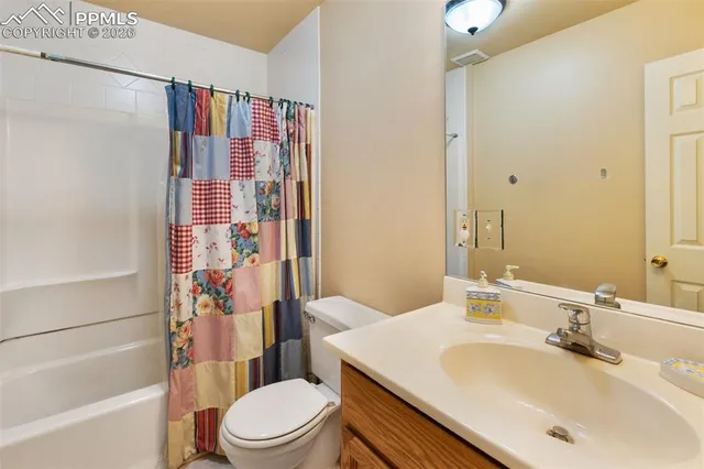 a bathroom with a sink a mirror and a shower