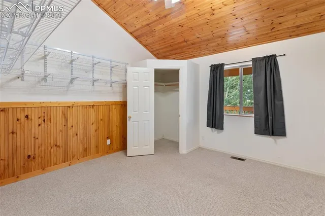 a view of an empty room with windows