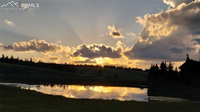a view of sunset and yard