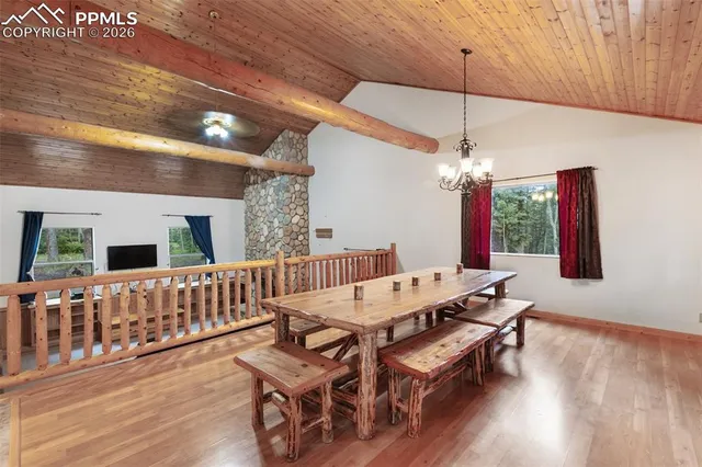 a spacious bathroom with a granite countertop sink a large mirror and a shower