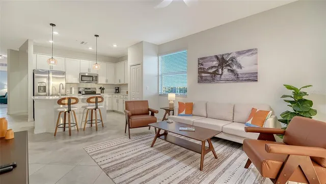 a bedroom with a large bed and a dresser