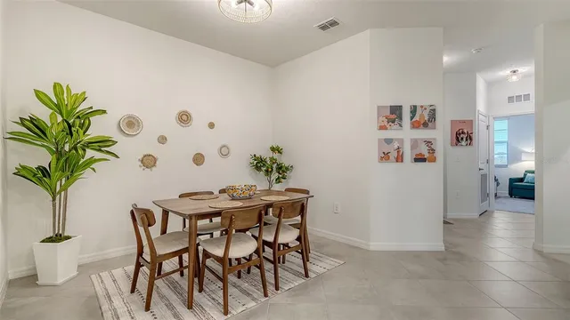 a bedroom with a bed couch and window