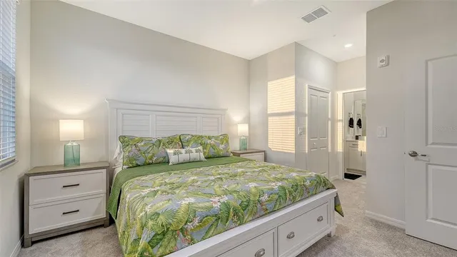 a balcony with furniture and a potted plant
