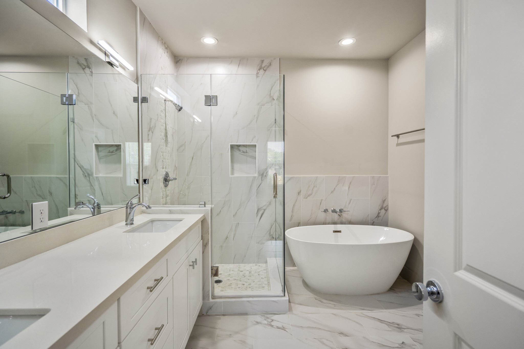 5229 Hillman Street, Unit A Houston, TX 77023 - Photo 18 of 50 a spacious bathroom with a double vanity sink mirror and double