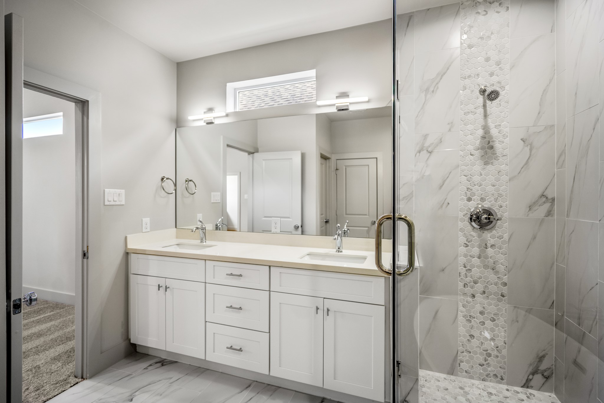 5229 Hillman Street, Unit A Houston, TX 77023 - Photo 20 of 50 a spacious bathroom with double vanity and a mirror