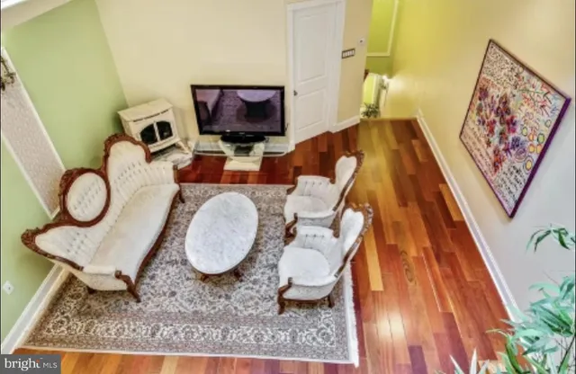 a bathroom with a granite countertop sink a toilet and a mirror
