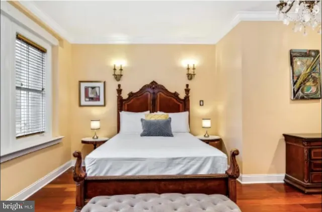a view of a dining room with furniture and a chandelier