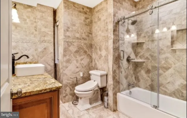 a bathroom with a sink double vanity mirror and a bathtub