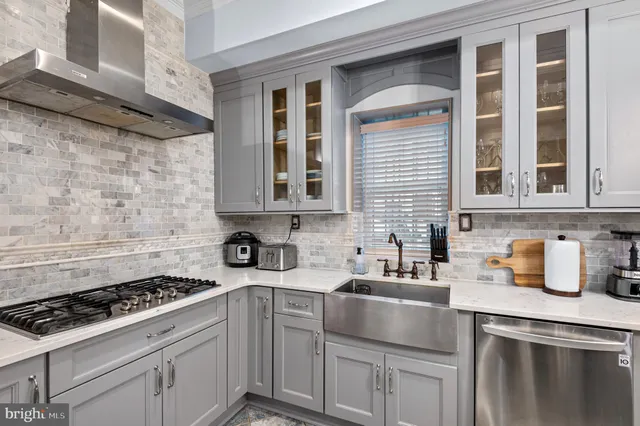 a kitchen that has a table and chairs in it