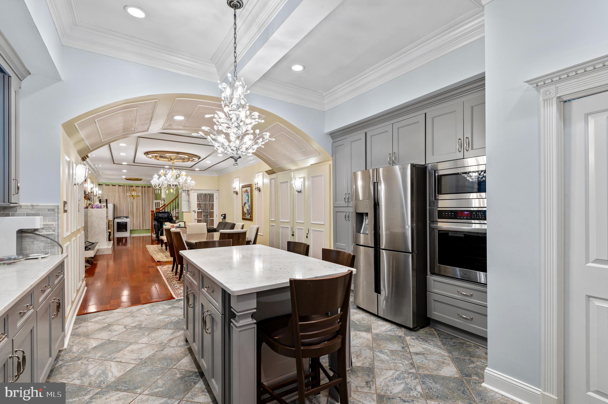 26 Strawberry Street Philadelphia, PA 19106 - Photo 48 of 64 a large kitchen with a table and refrigerator
