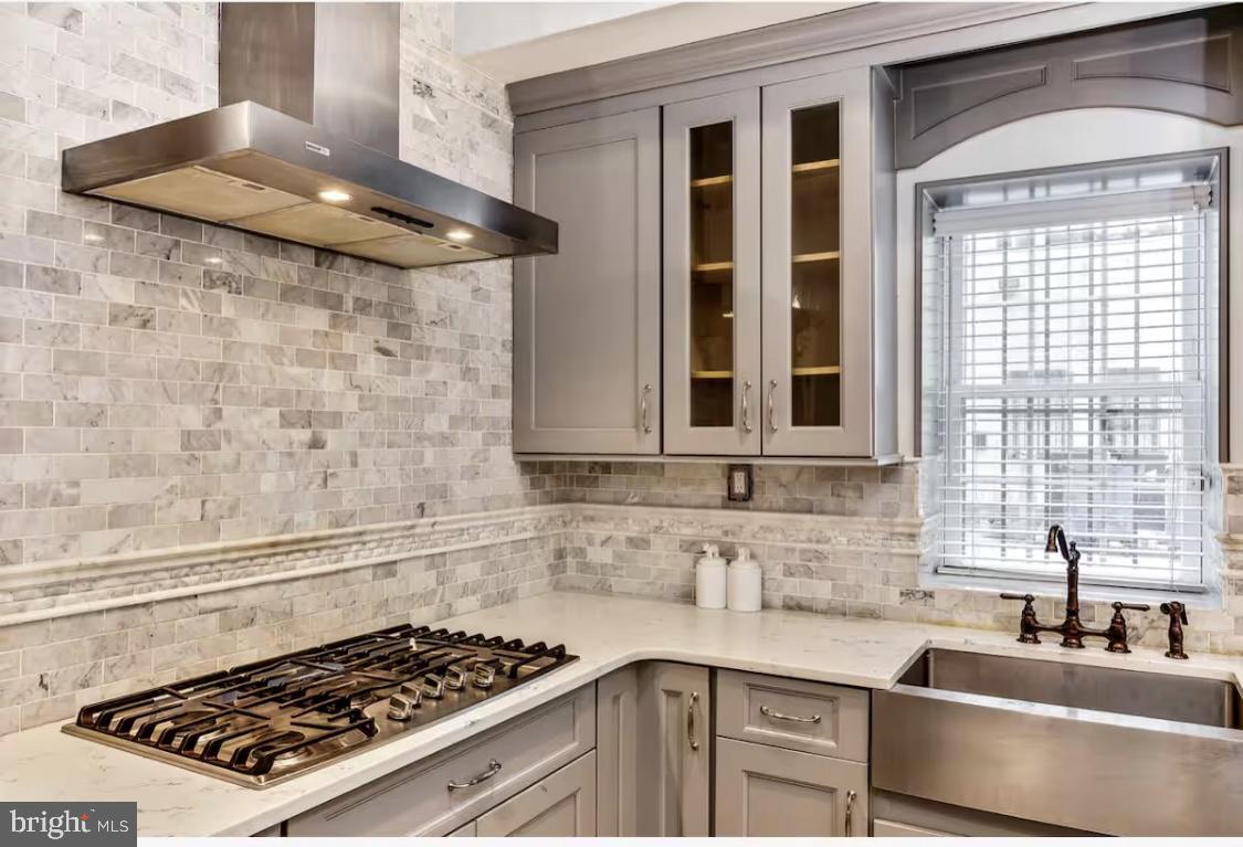 26 Strawberry Street Philadelphia, PA 19106 - Photo 7 of 64 a kitchen with granite countertop a sink stove and cabinets
