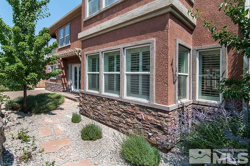 1629 Crescent Pointe Way Reno, NV 89523 - Photo 5 of 25 a front view of a house with garden