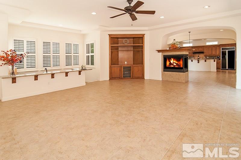 1629 Crescent Pointe Way Reno, NV 89523 - Photo 8 of 25 a view of an empty room with a fireplace and a window