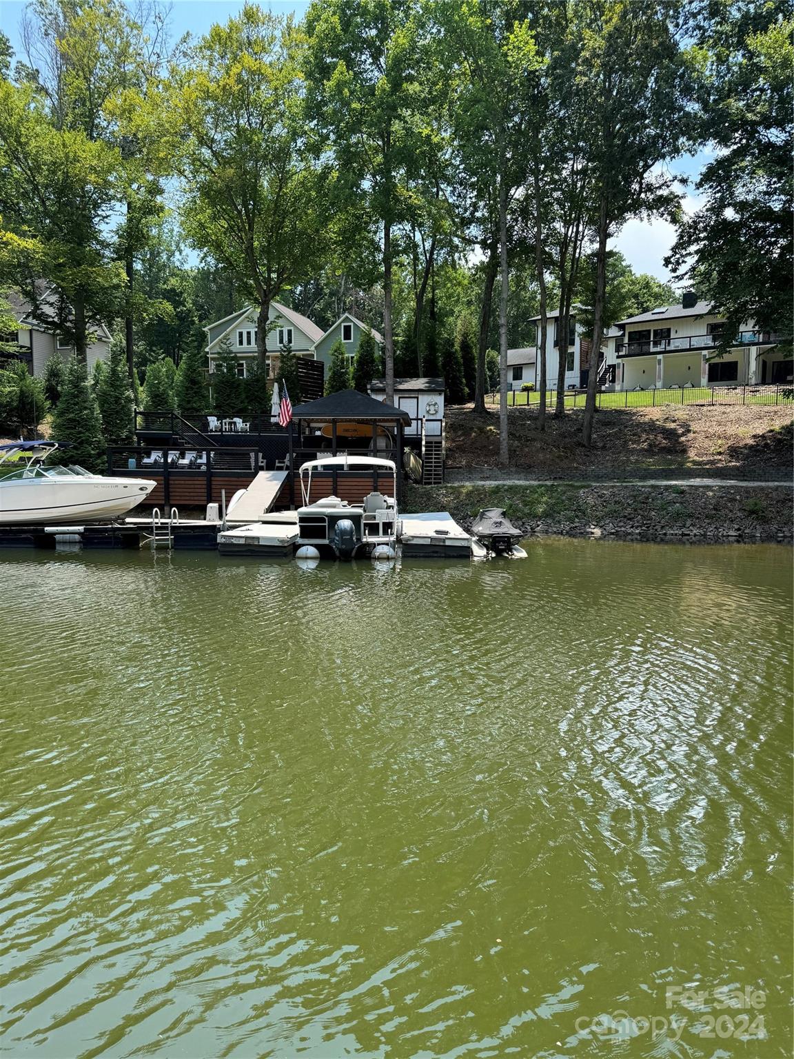 8733 Holdsclaw Road Terrell, NC 28682 - Photo 1 of 16 a view of swimming pool with lawn chairs and plants