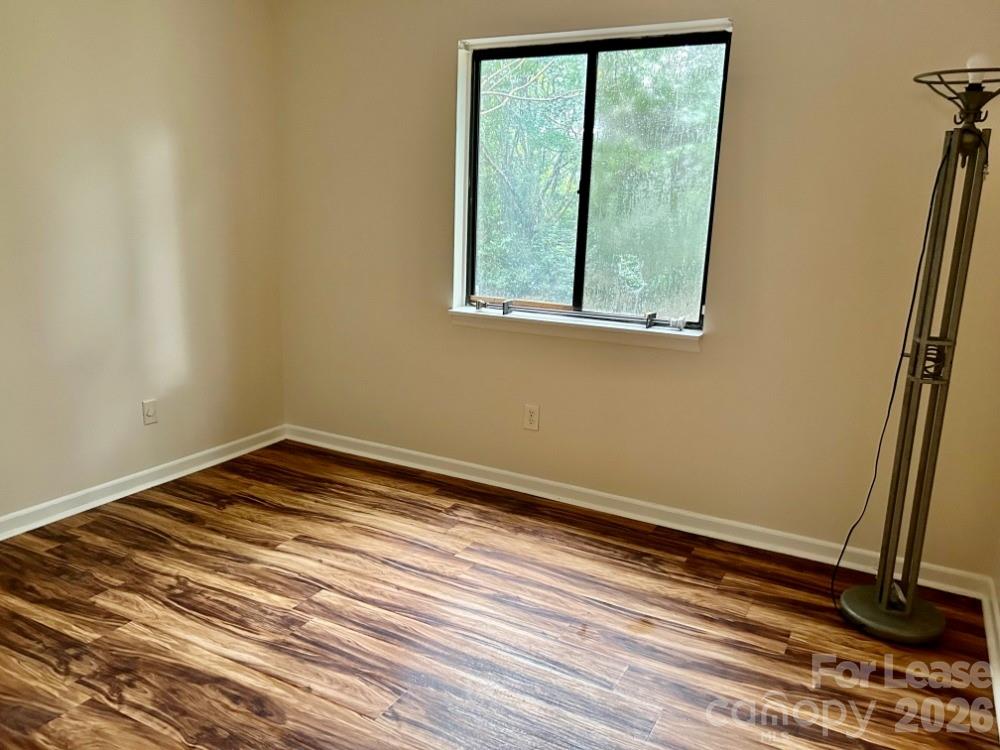 11020 Harrowfield Road Charlotte, NC 28226 - Photo 10 of 14 a view of a room with wooden floor and window