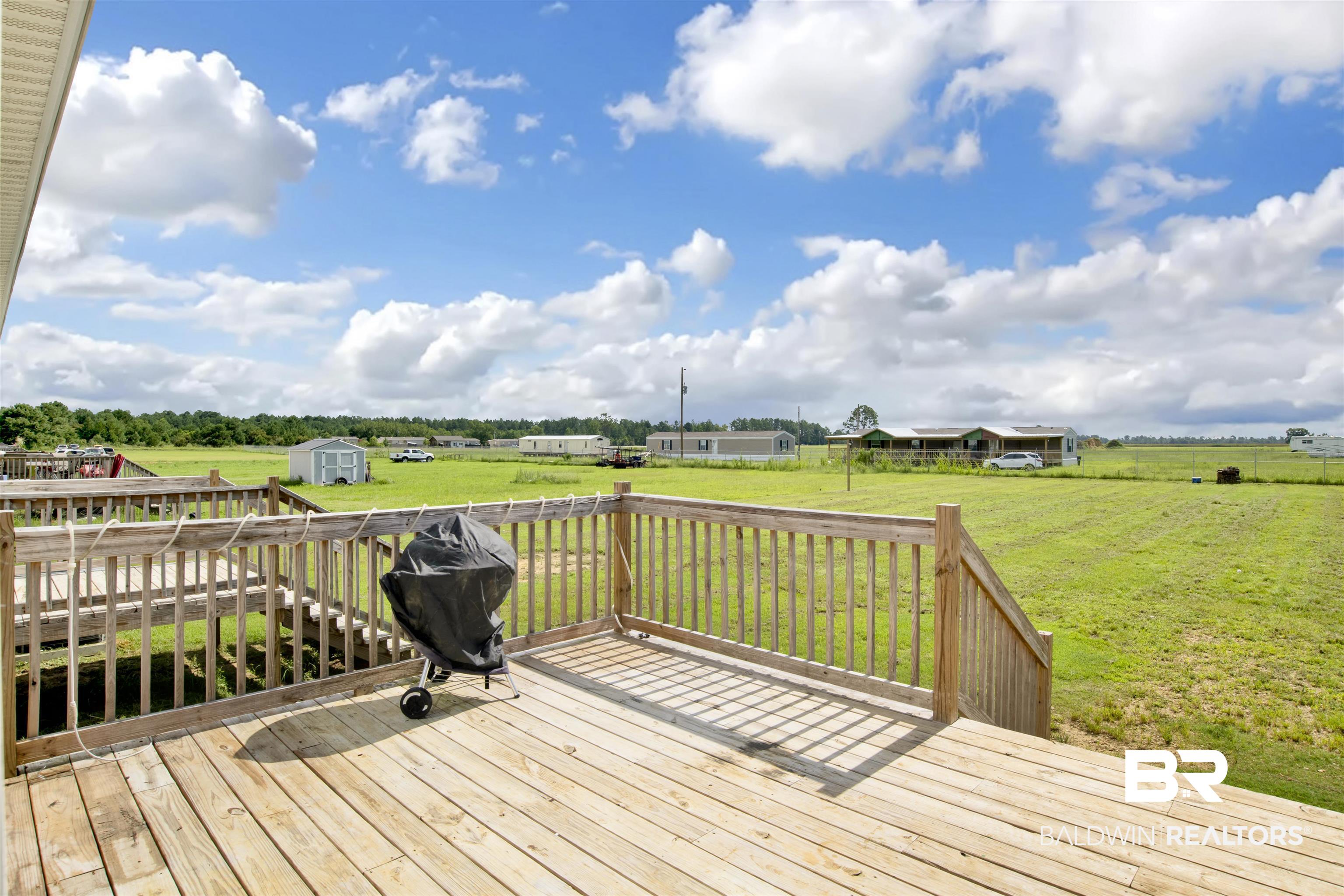 16778 County Road 87 Elberta, AL 36530 - Photo 8 of 32 Wooden deck with a shed and a yard
