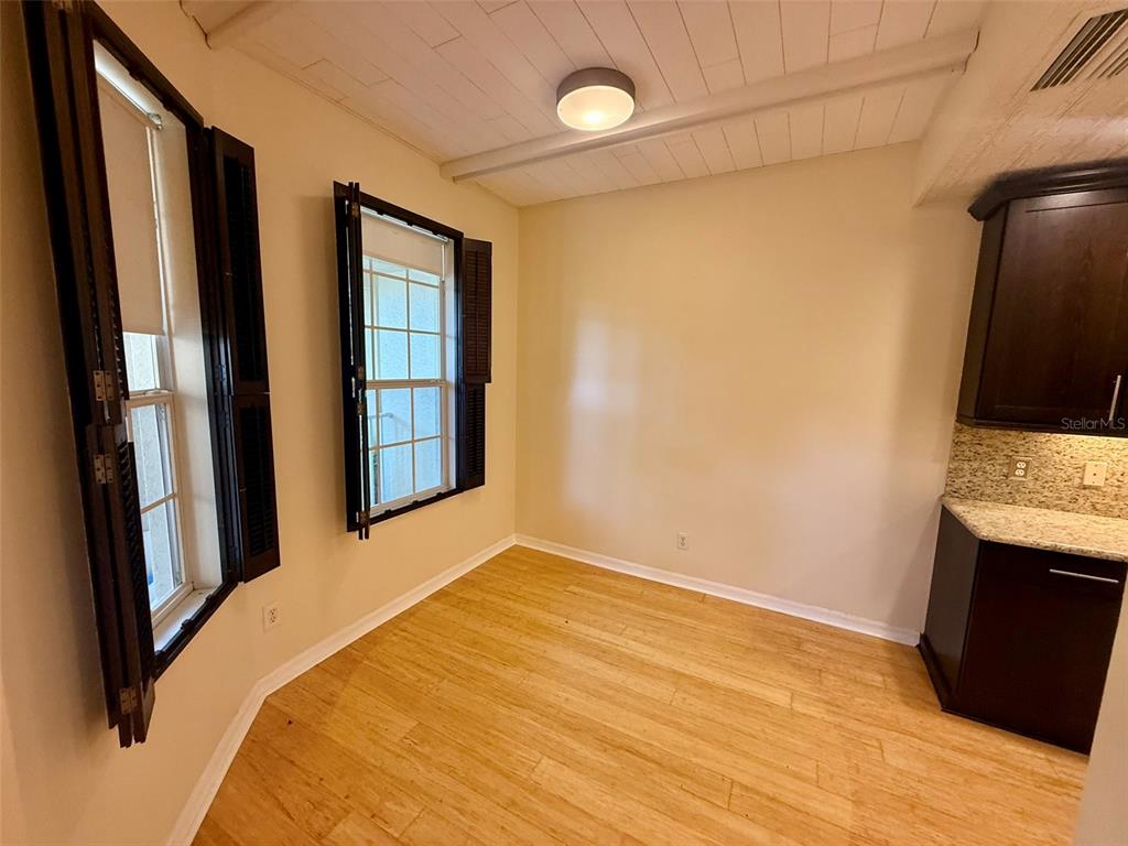 5511 Key W Place, Unit 5511 Bradenton, FL 34203 - Photo 17 of 39 a bedroom with a bed and a flat tv screen