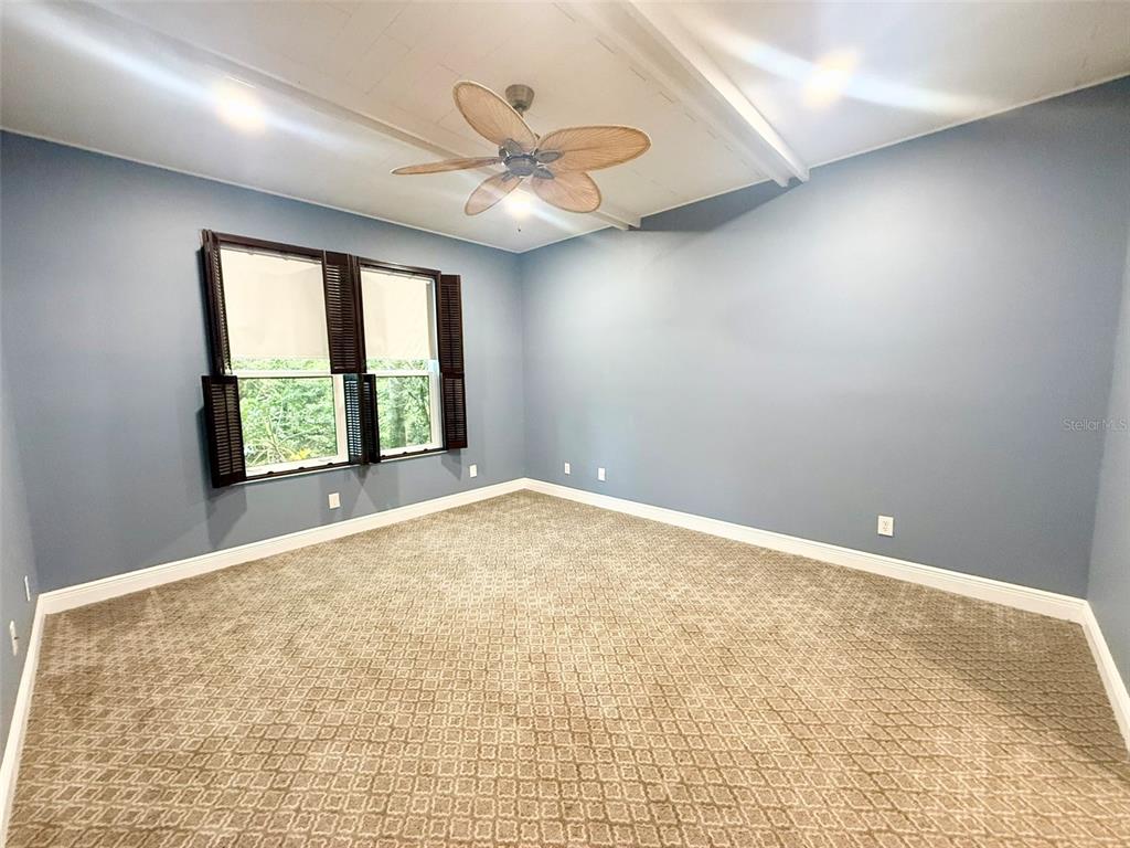 5511 Key W Place, Unit 5511 Bradenton, FL 34203 - Photo 31 of 39 an empty room with windows and fan