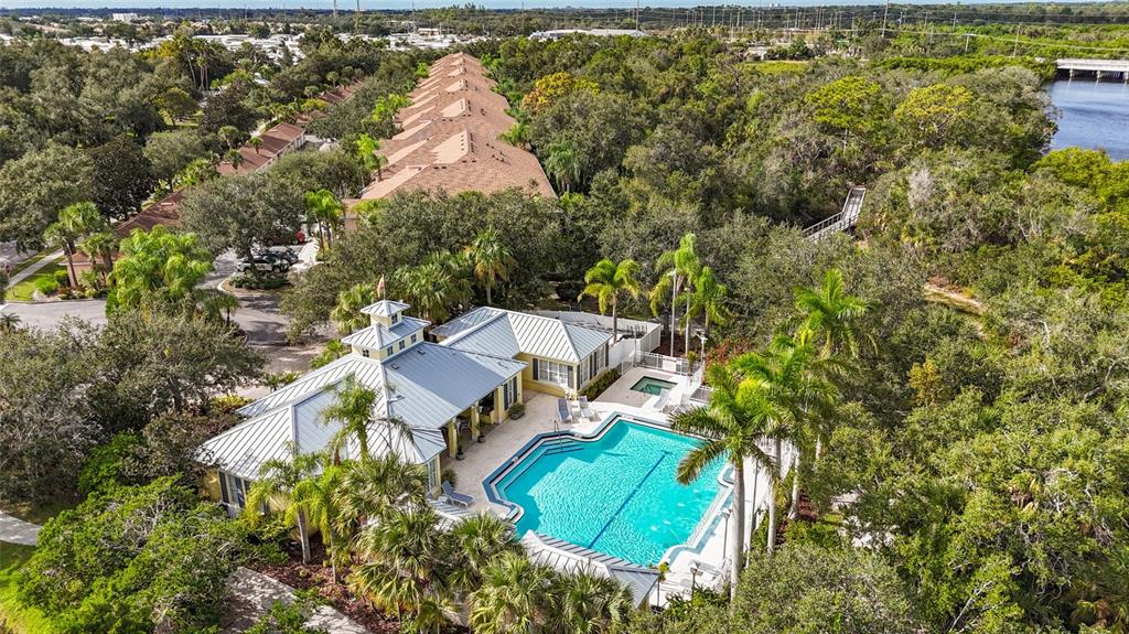5511 Key W Place, Unit 5511 Bradenton, FL 34203 - Photo 6 of 39 an aerial view of a house with a yard and trees
