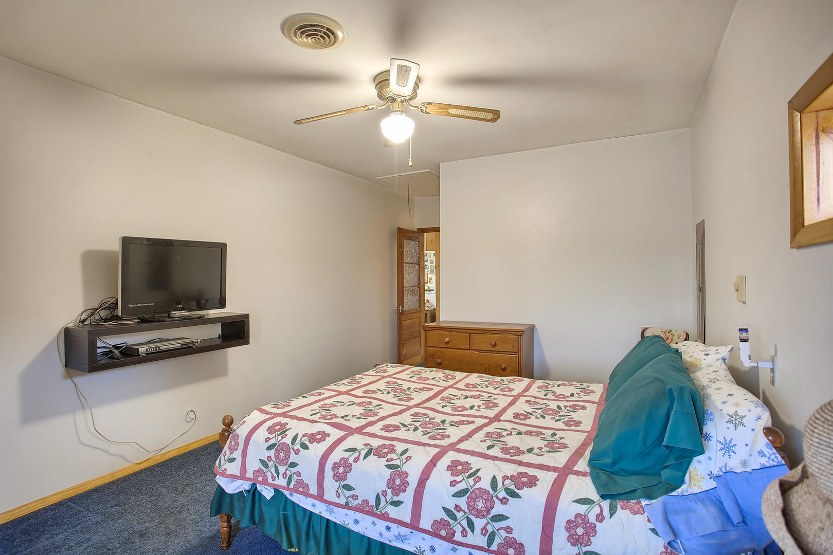 408 Kyle Street Ogden, IL 61859 - Photo 11 of 24 a bedroom with a bed and a flat screen tv