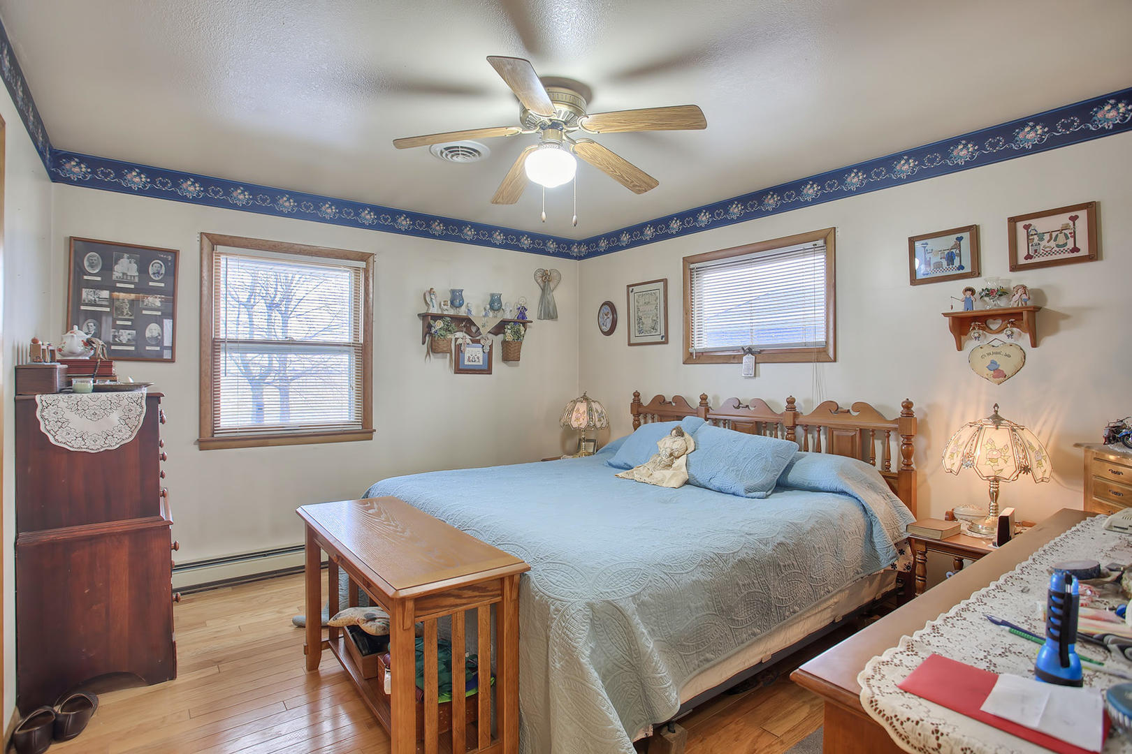 408 Kyle Street Ogden, IL 61859 - Photo 14 of 24 a bedroom with a bed and a table with bookshelf
