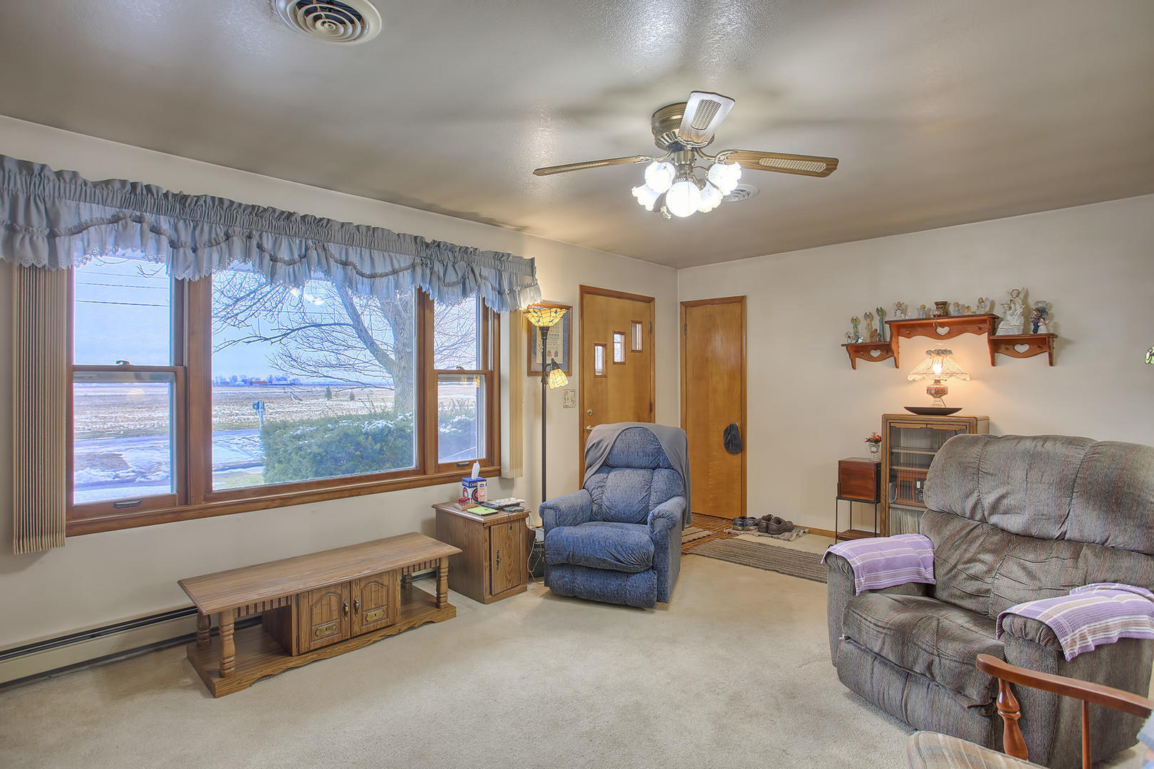 408 Kyle Street Ogden, IL 61859 - Photo 3 of 24 a living room with furniture and a large window